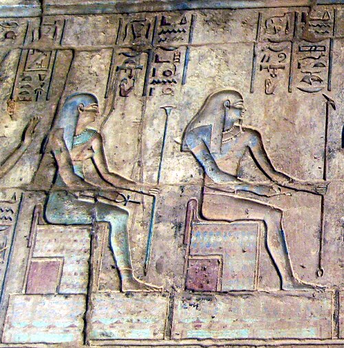 Relief from the Ptolemaic-era temple at Deir el-Medina depicting Kuk (Kek), god of primordial darkness, with his consort Kauket.
